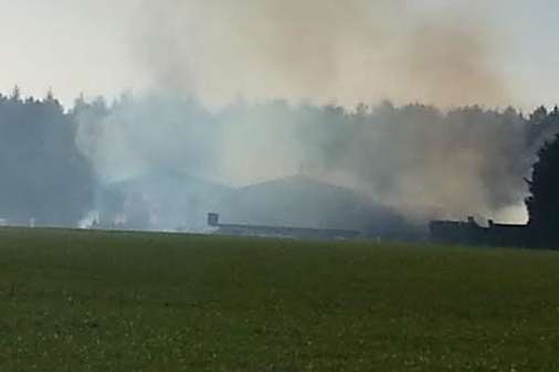 Smoke billows into the sky from a Barham barn fire