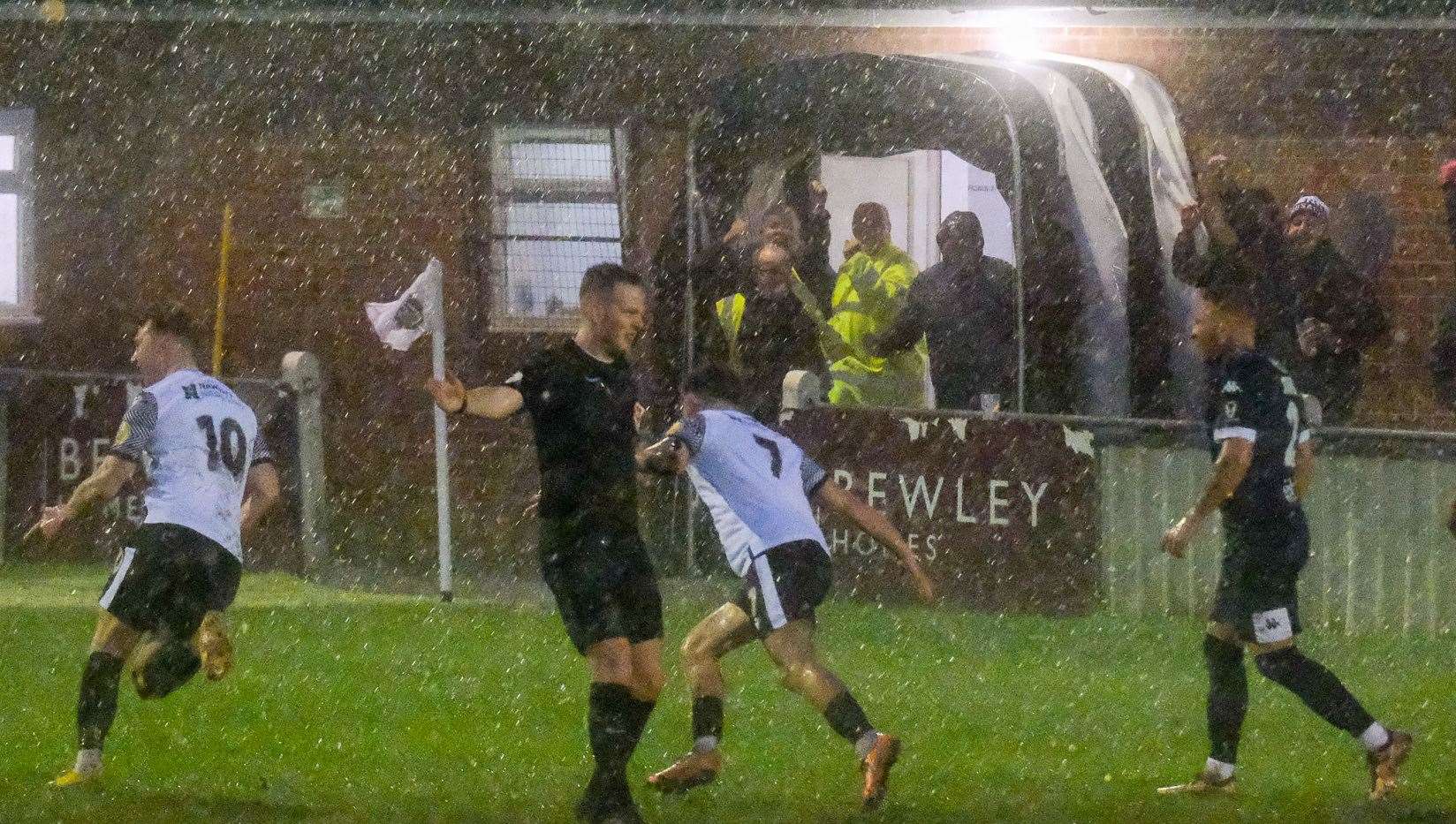 Hungerford celebrate in the hail in their weekend 1-0 win over Dover