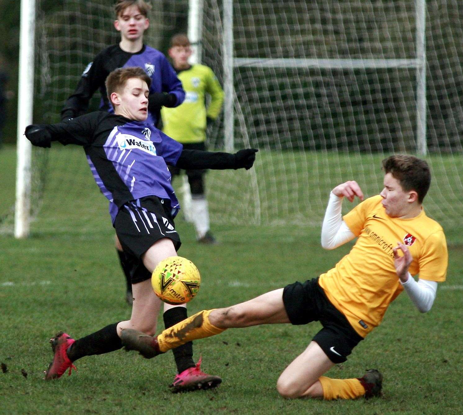 Thamesview (yellow) slide in against Anchorians Pumas in Under-15 Division 2 Picture: Phil Lee