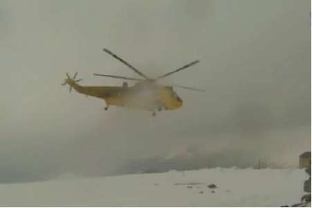 A Sea King rescue helicopter takes off after saving the mother and son on Mount Snowdon