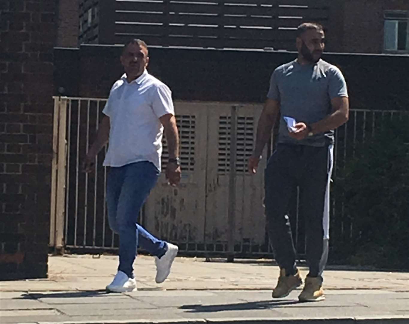 Salam Osman and Arsalan Saed leaving the hearing at Canterbury Magistrates' Court after facing charges of conspiring to sell illegal tobacco (14182346)