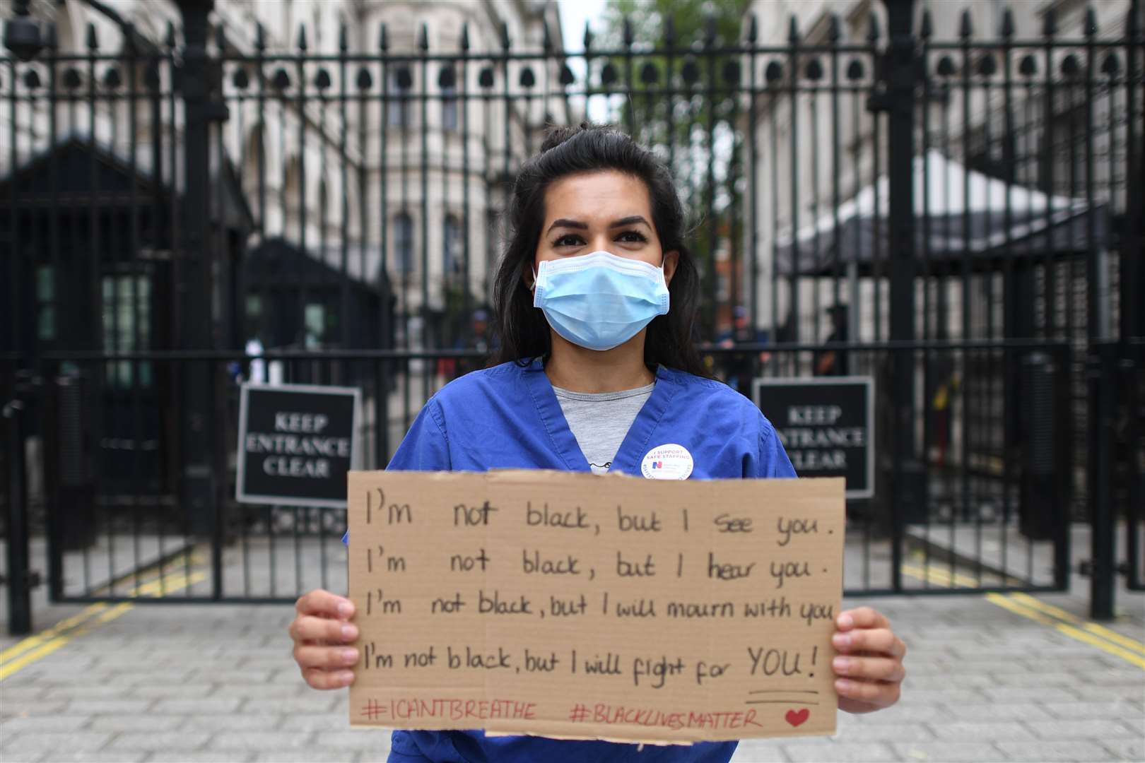 Nurse Ameera Sheikh protests outside Downing Street (Stefan Rousseau/PA)