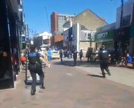 Officers running to the scene in Chatham High Street