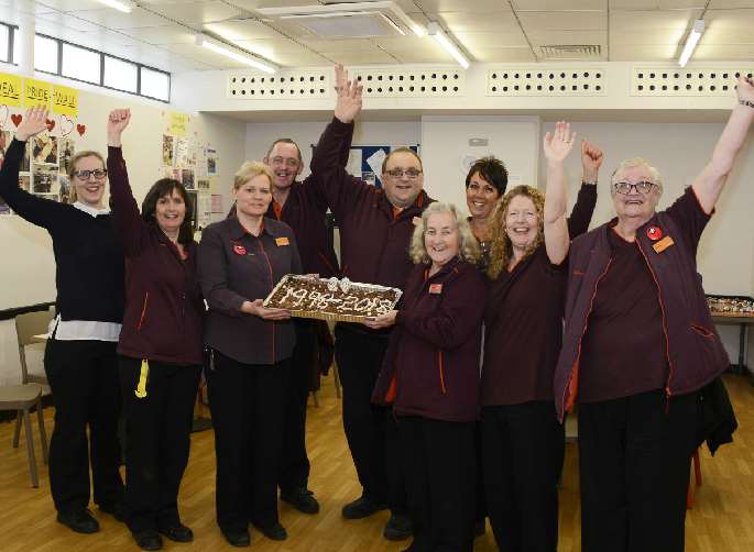Long serving staff celebrated with a slice of cake