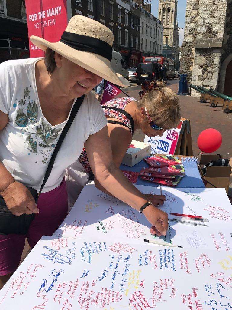 Locals sign the NHS card in Dover. Picture: Dover and Deal Labour Party