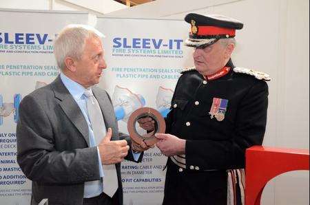 Viscount De L'Isle, Lord Lieutenant of Kent, presents the Queen's Award to Bill Hoffman, founder of Sleev-it Fire Systems in Rainham