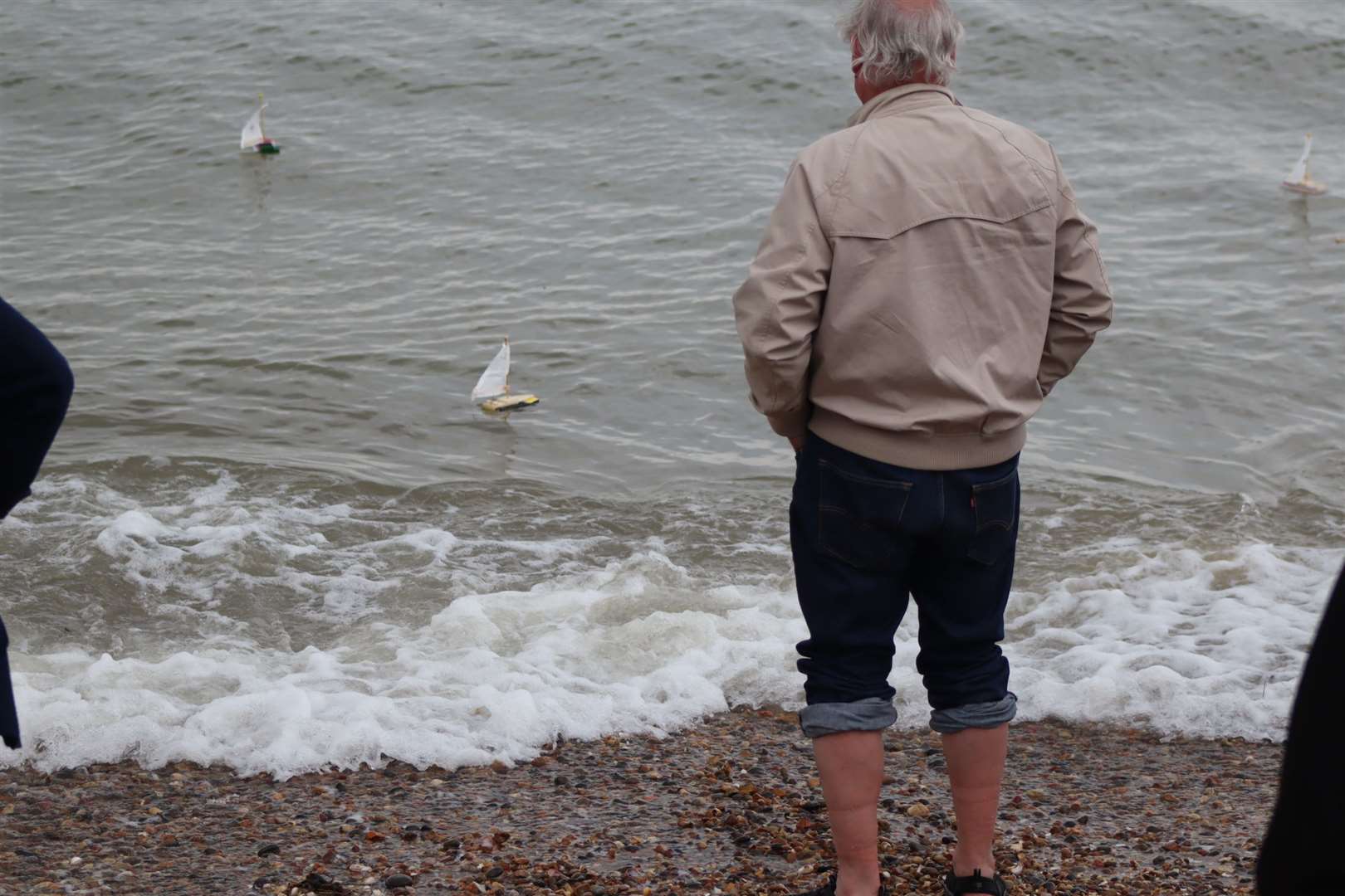 Solicitor Richard Murr watches from the beach as his two boats take to the water at Minster, Sheppey, for the launch of the Freemasons' Great East Kent Boat Race