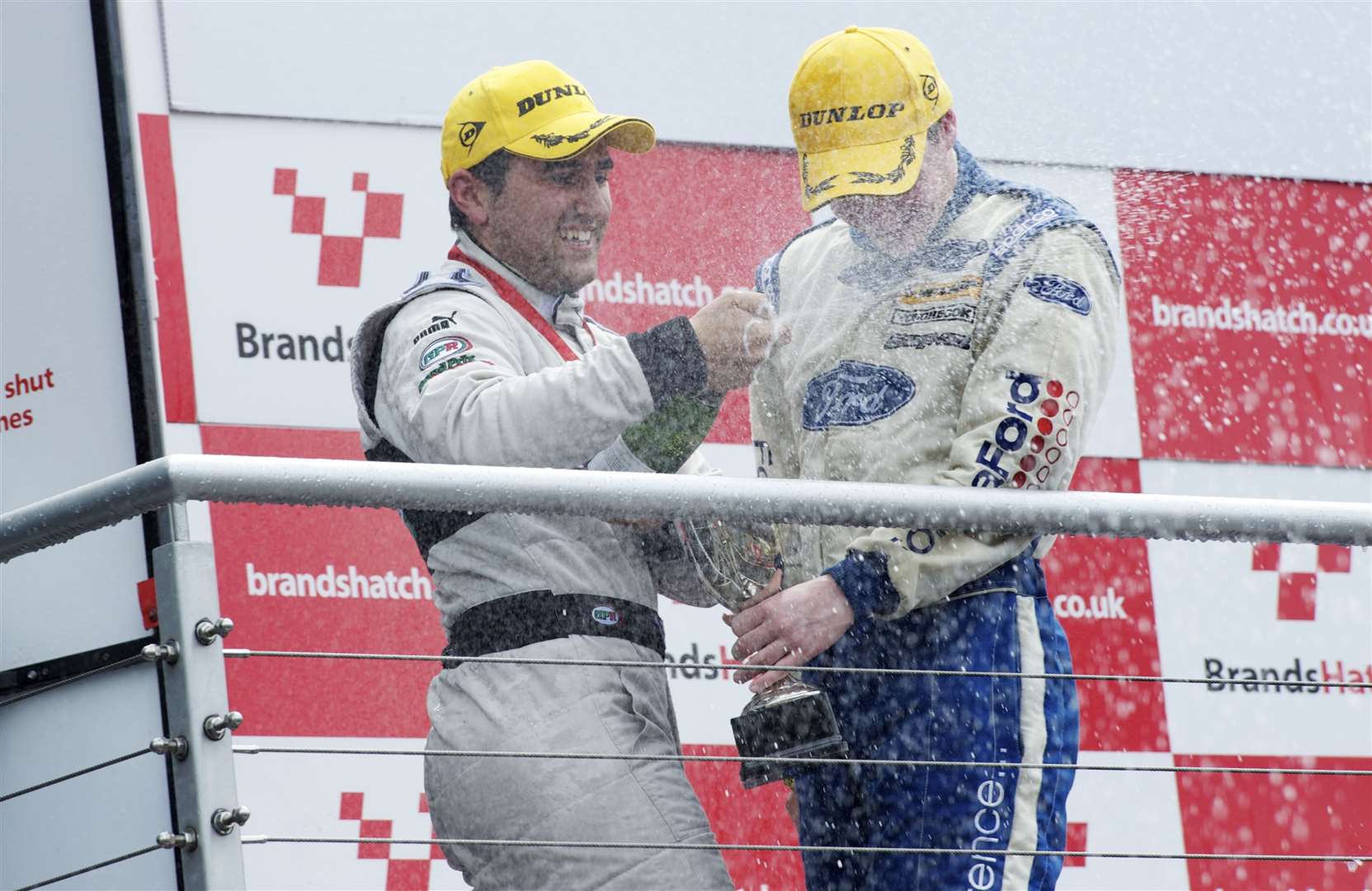 Scott Malvern, left, says he "wouldn't have a career if it wasn't for Buckmore". He's pictured here at Brands Hatch in July 2011 after winning a British Formula Ford Championship round with Rochester-based Jamun Racing