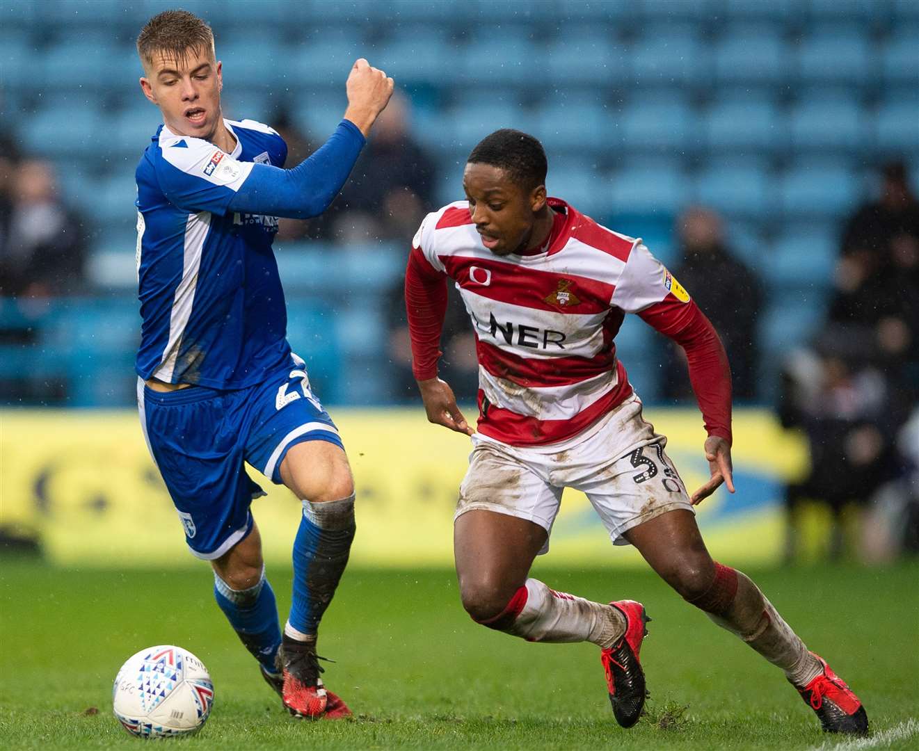 Gills defender Jack Tucker closes in on Doncaster's Niall Ennis on Saturday. Picture: Ady Kerry