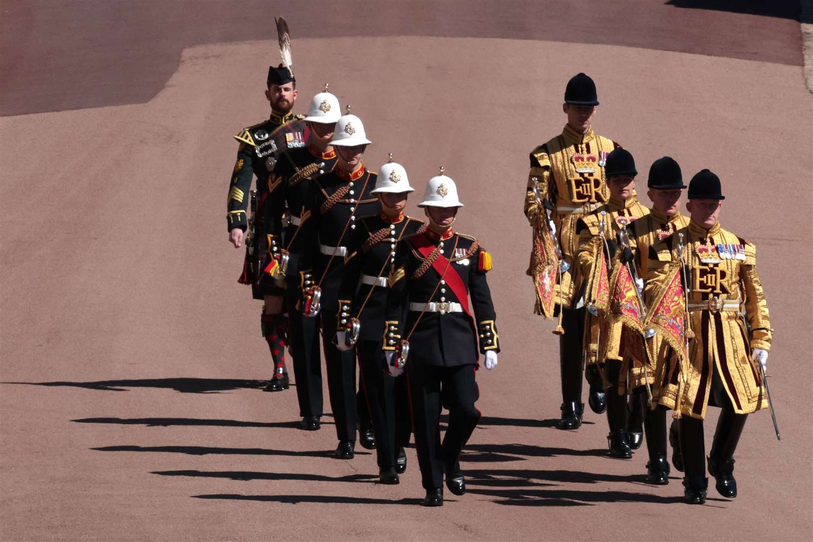 Marching outside St George’s Chapel (Hannah McKay/PA)