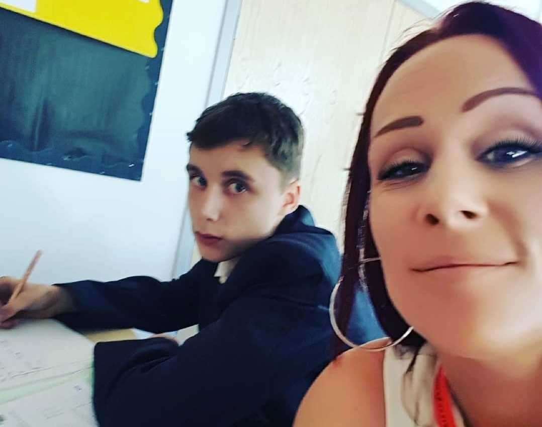 Becky Crandley sitting in the classroom with her son Harley