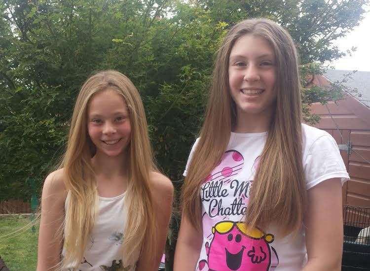 Gracie Saunders (right) and sister Chloe from Sheppey who are having their hair cut for charity
