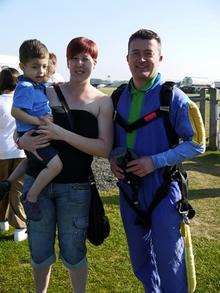 Natalie and Oliver Smith with dock worker Steve Craig after his sky dive