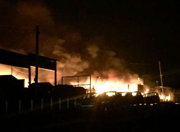 Flames engulfed parts of the workshop. Picture: KFRS