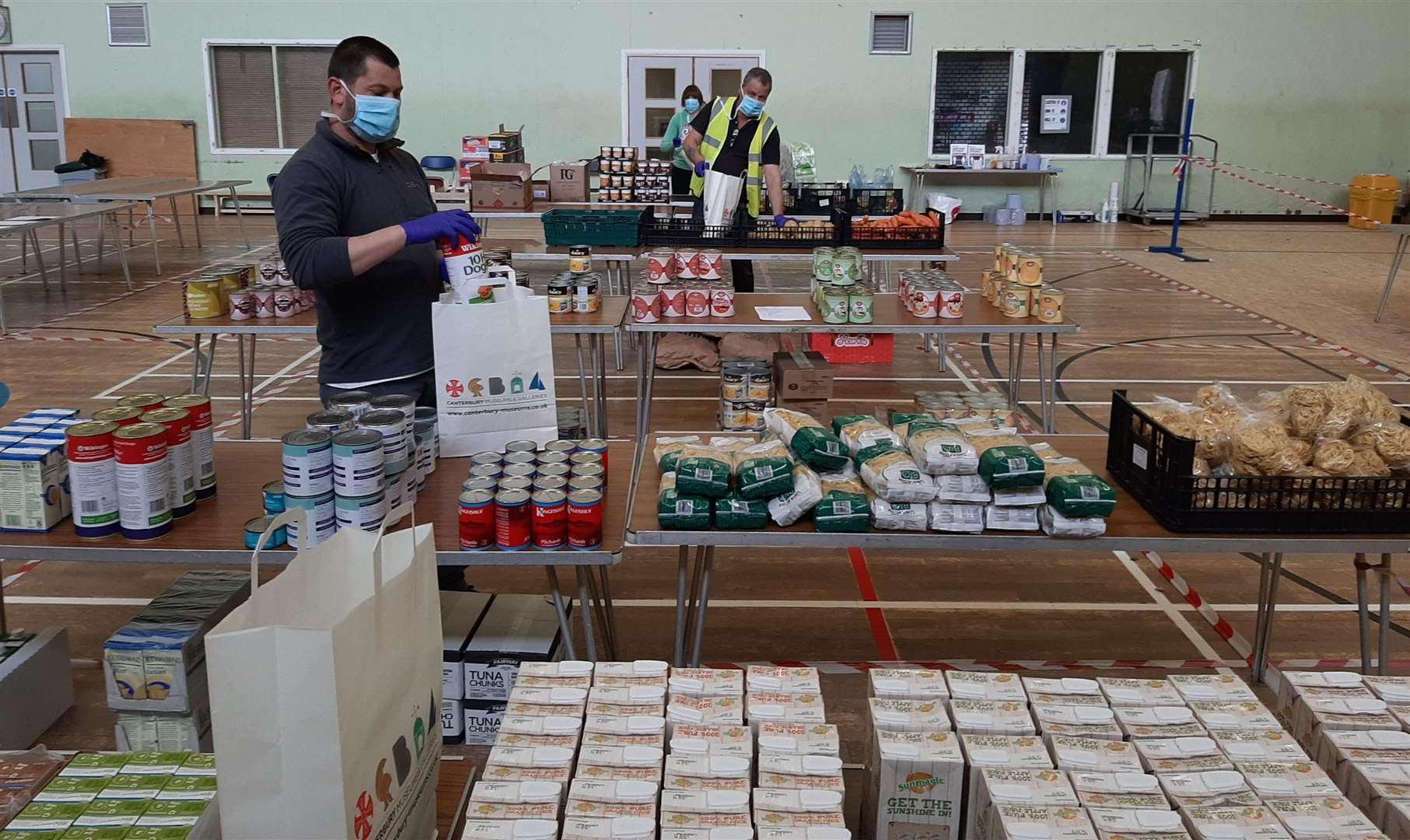 Volunteers sort through food to be distributed to vulnerable people who aren't able to get out to the shops. Picture: Canterbury City Council
