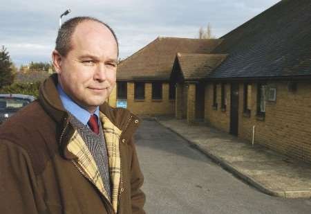 Cllr John Wright outside Newington village hall, which has suffered with anti-social behaviour. Picture: MIKE SMITH