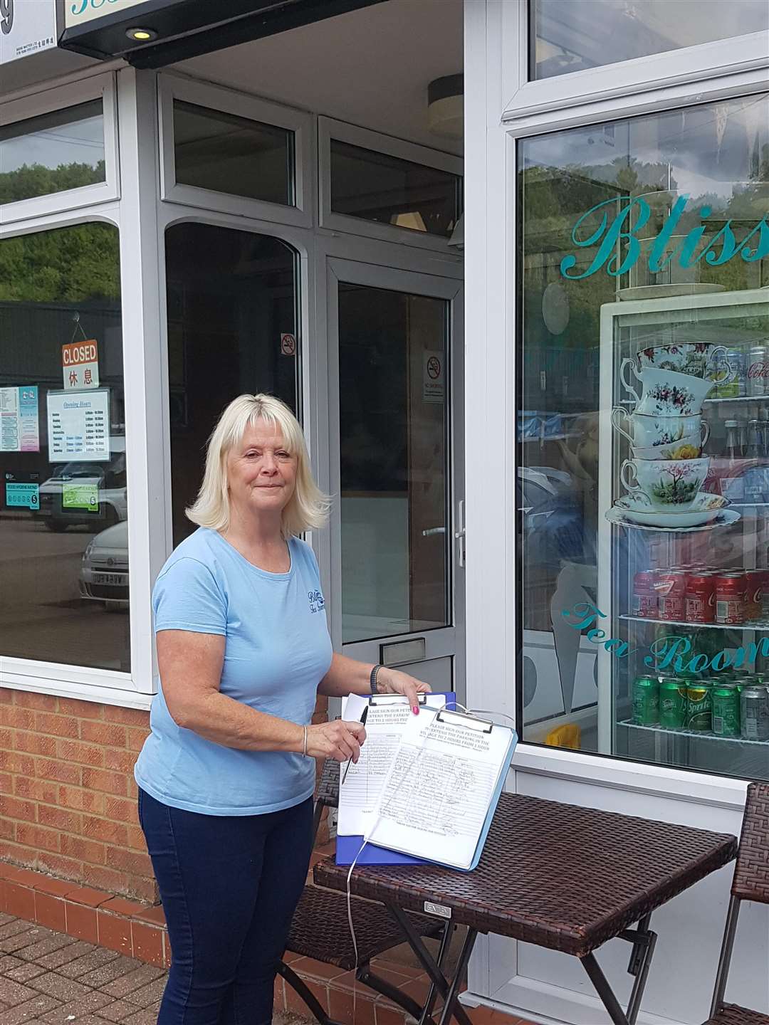 Shirley Bliss with her petition to extend the parking hours outside Bliss Tea Rooms in Walderslade Village (3687424)