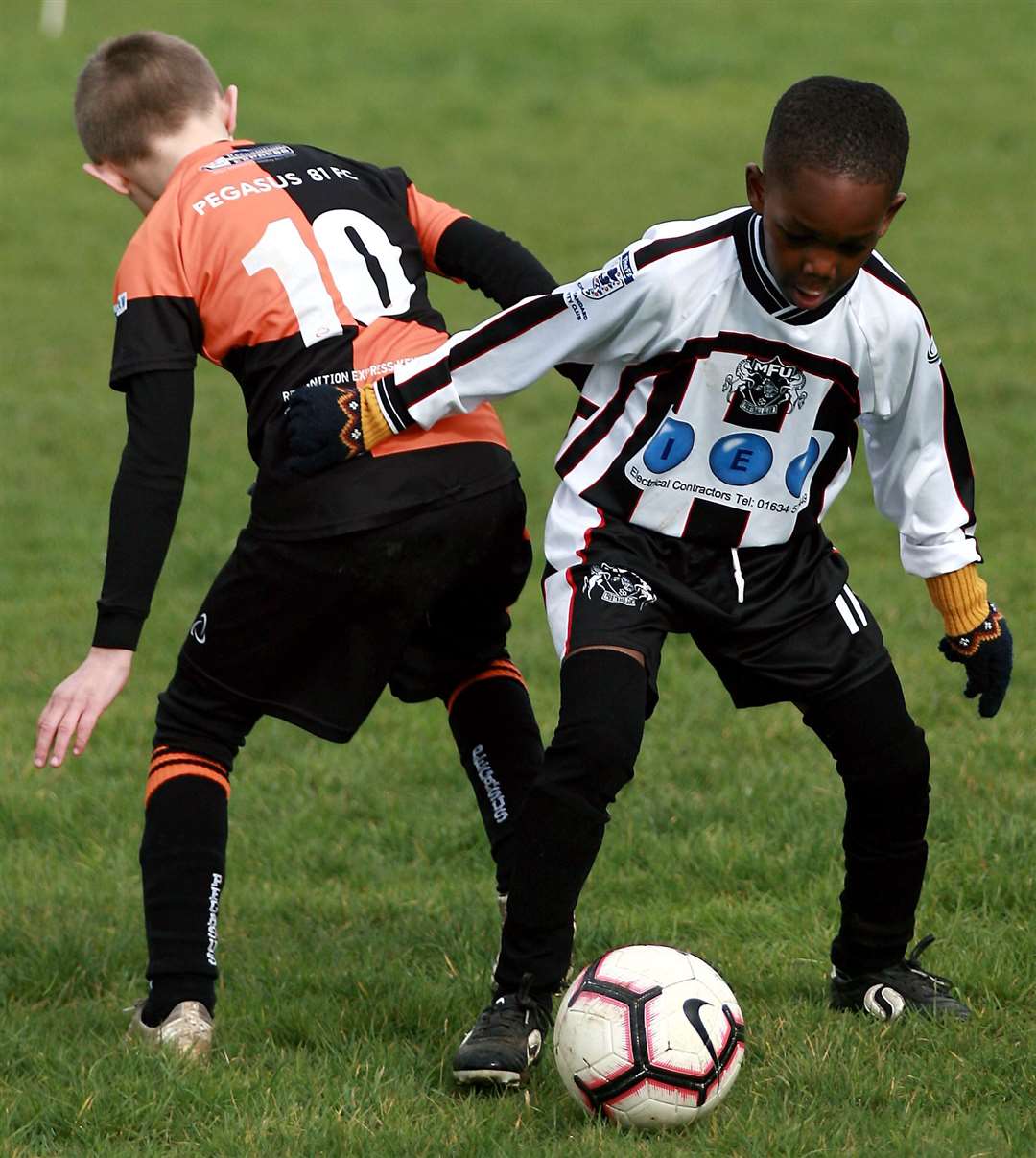 Milton & Fulston under-8s on the ball against Pegasus 81 under-8s. Picture: Phil Lee FM29961655