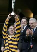 Maidstone's captain Tom Lane with the trophy. Picture courtesy GERRY McMANUS
