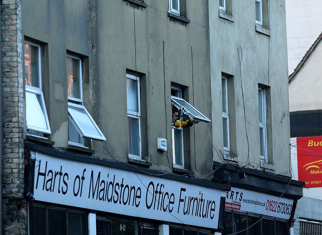 A man was seen shouting out of the window during the incident. Picture: Keith Thompson