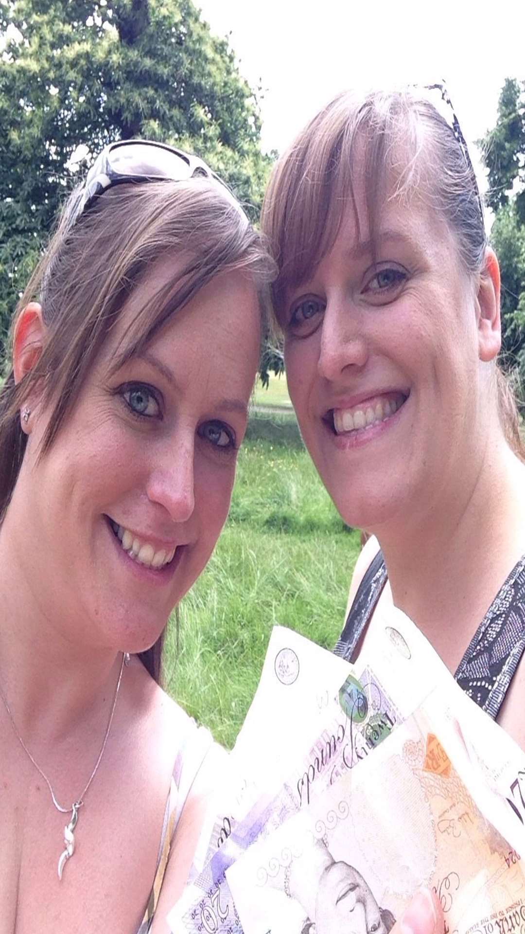 Amy and Kate Edwards tweeted this photo of themselves with the HiddenCash money