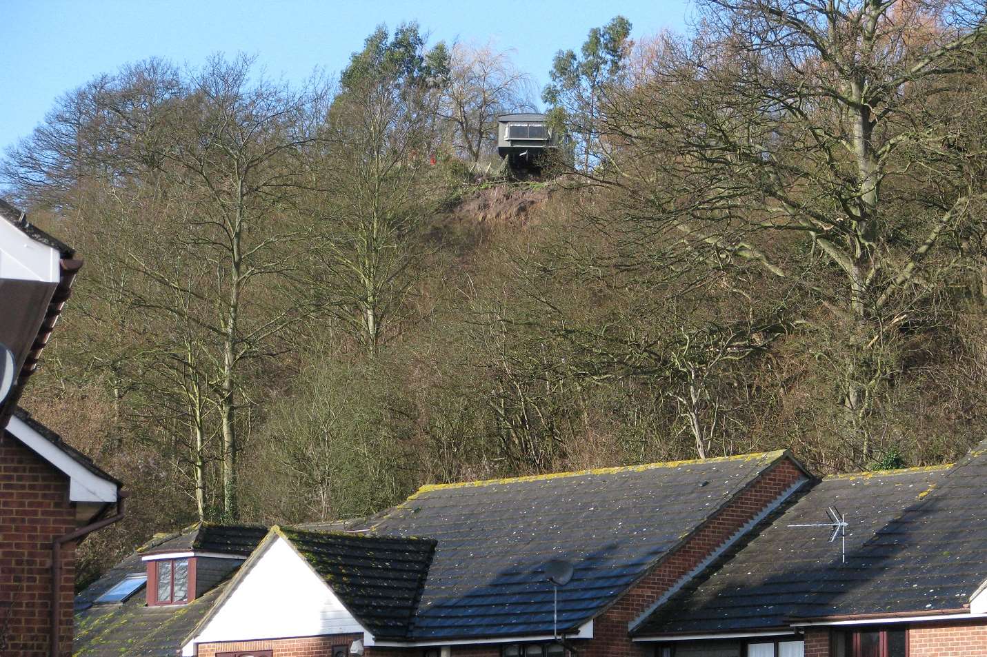 This caravan was left hanging precariously above Lower Upnor after a cliff edge fell away