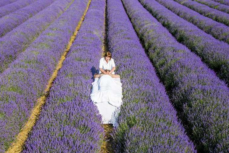 Mary Anderson enjoys a relaxing massage from aromatherapist Jackie in the Hop Shop's fields of lavender at Castle Farm.
