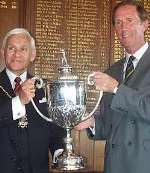 BIG MOMENT: Howard Moxon receives the challenge cup from deputy mayor Cllr Deryck Murray. Picture: KEVIN REDSULL