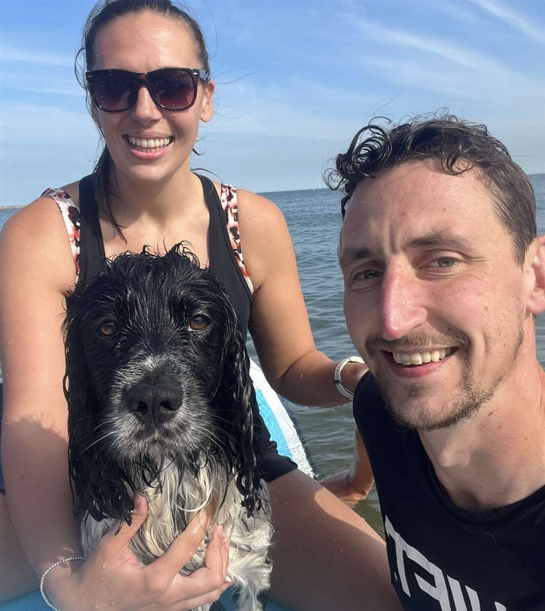 Georgia Hearn with her partner, Chris, and their dog, Sully, in sea off Hampton, Herne Bay