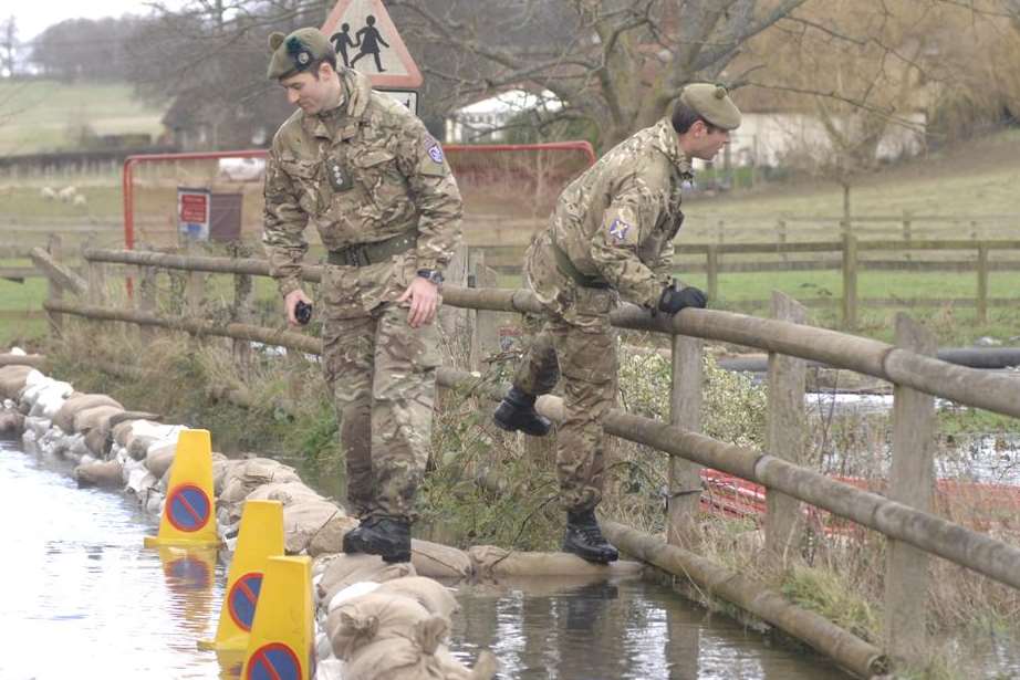 Soldiers helping to reinforce flood defences in Bishopsbourne. Picture: Chris Davey