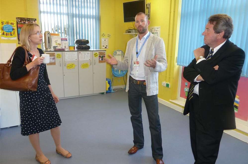 Jenny Whittle, Kent County Council's cabinet member for specialist children's services, speaks with Rob Jobe, manager of Woodgrove Children's Centre, and MP Gordon Henderson