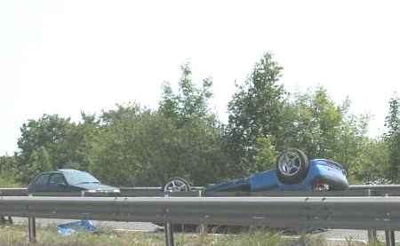 The overturned Peugeot in which the woman was trapped. Picture: DARRYL FINCH