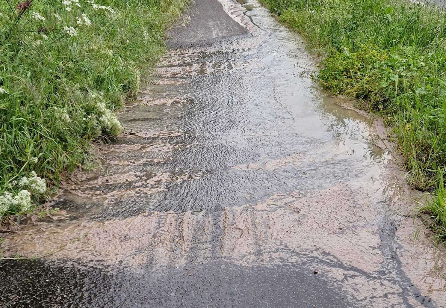 Sewage can be seen spilling onto the path next to a turnoff on the A282 in Dartford, near the Holiday Inn