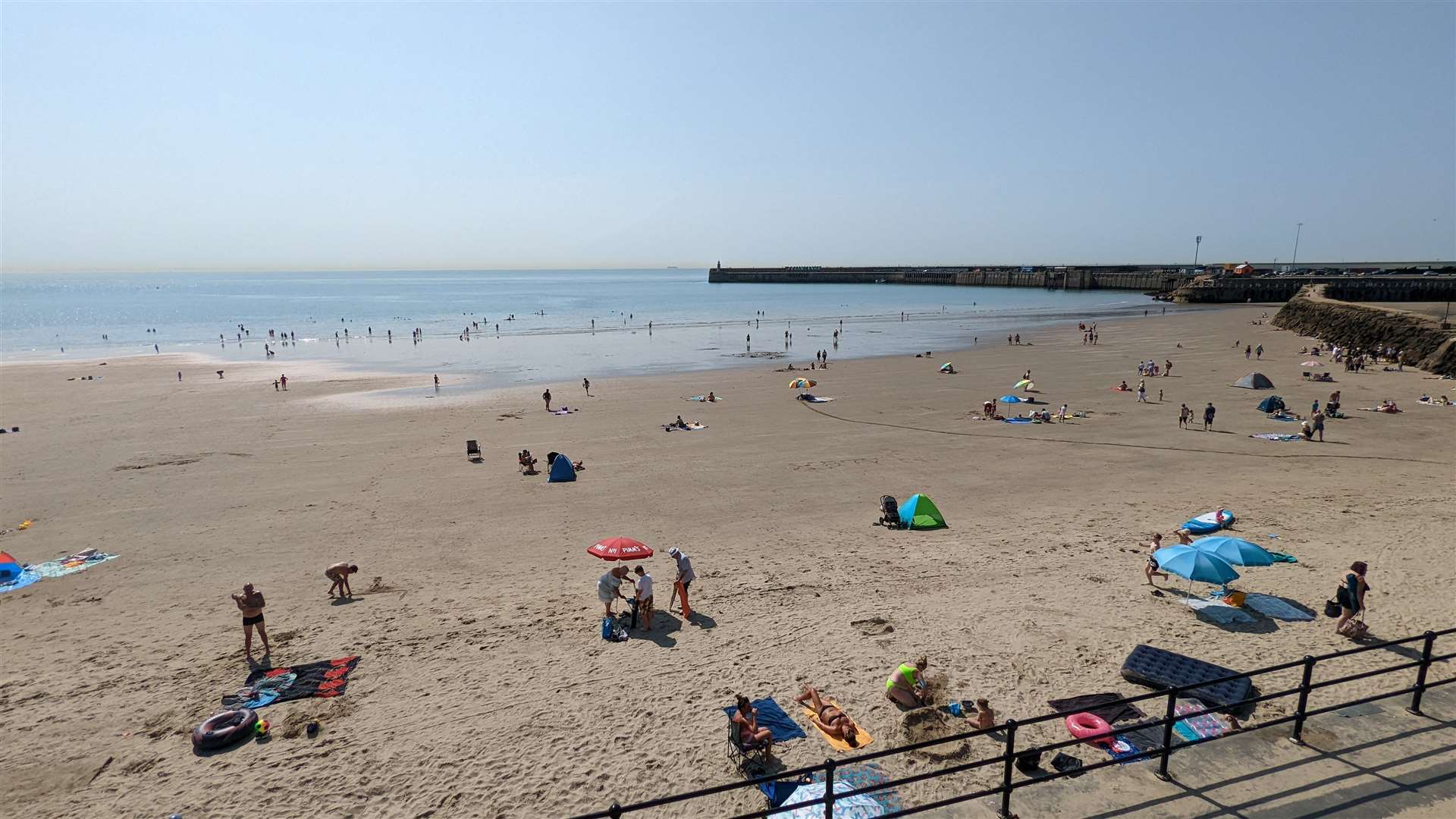 Folkestone, pictured during this summer's heatwave, is becoming an increasingly popular place to move to
