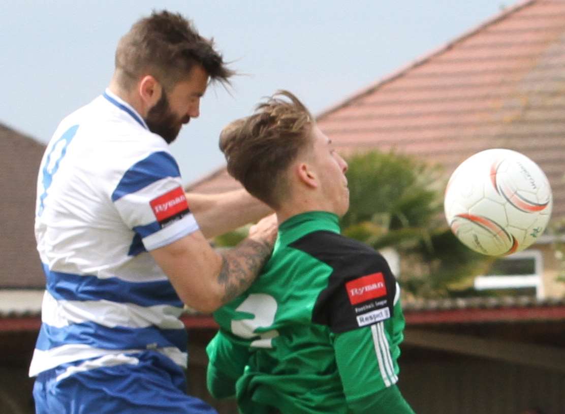 Margate's Ryan Moss gets a header in during the promotion play-off final against Hendon. Picture: Don Walker