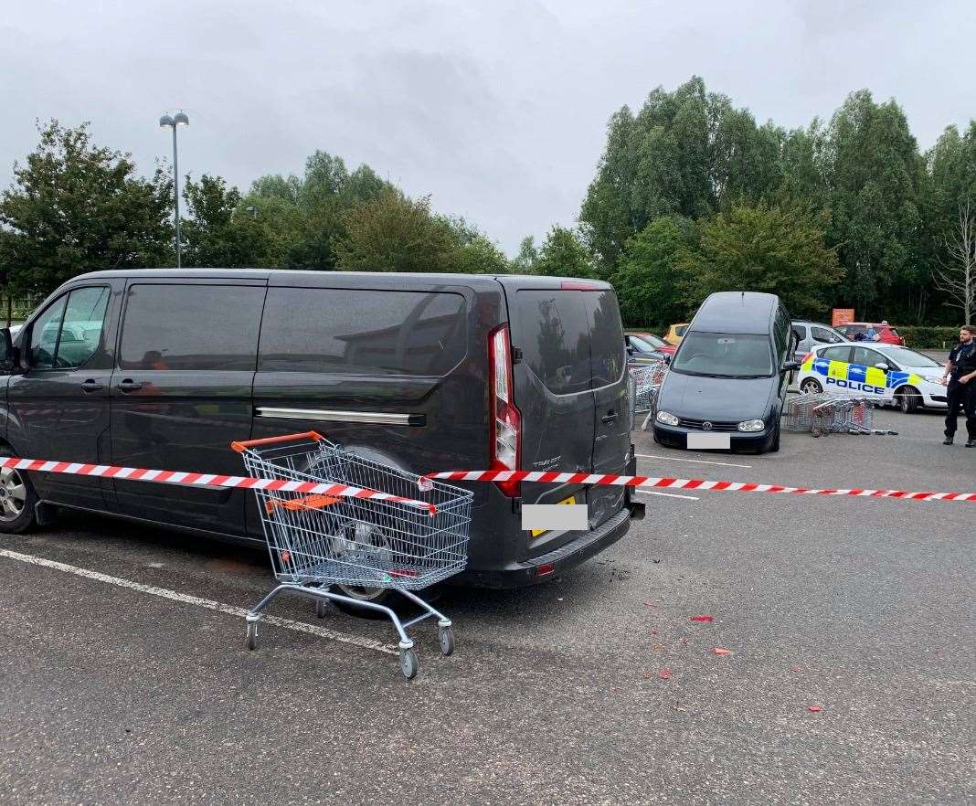 A parked van was hit before the VW Golf struck the trolleys