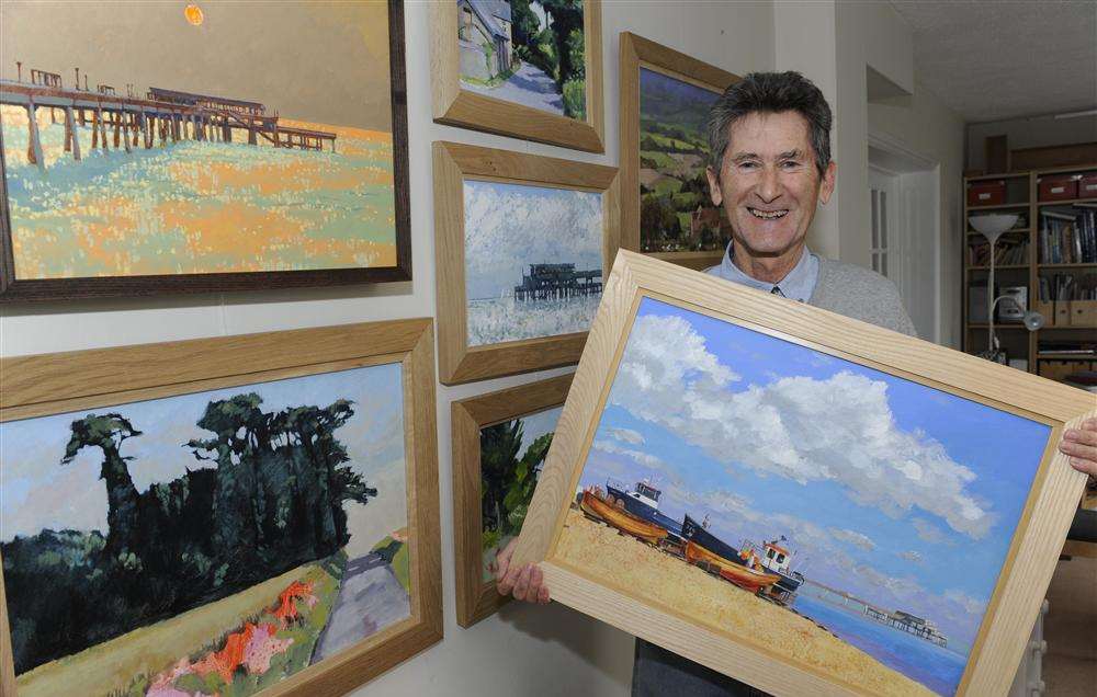 Artist Clive Metcalfe with some of his work