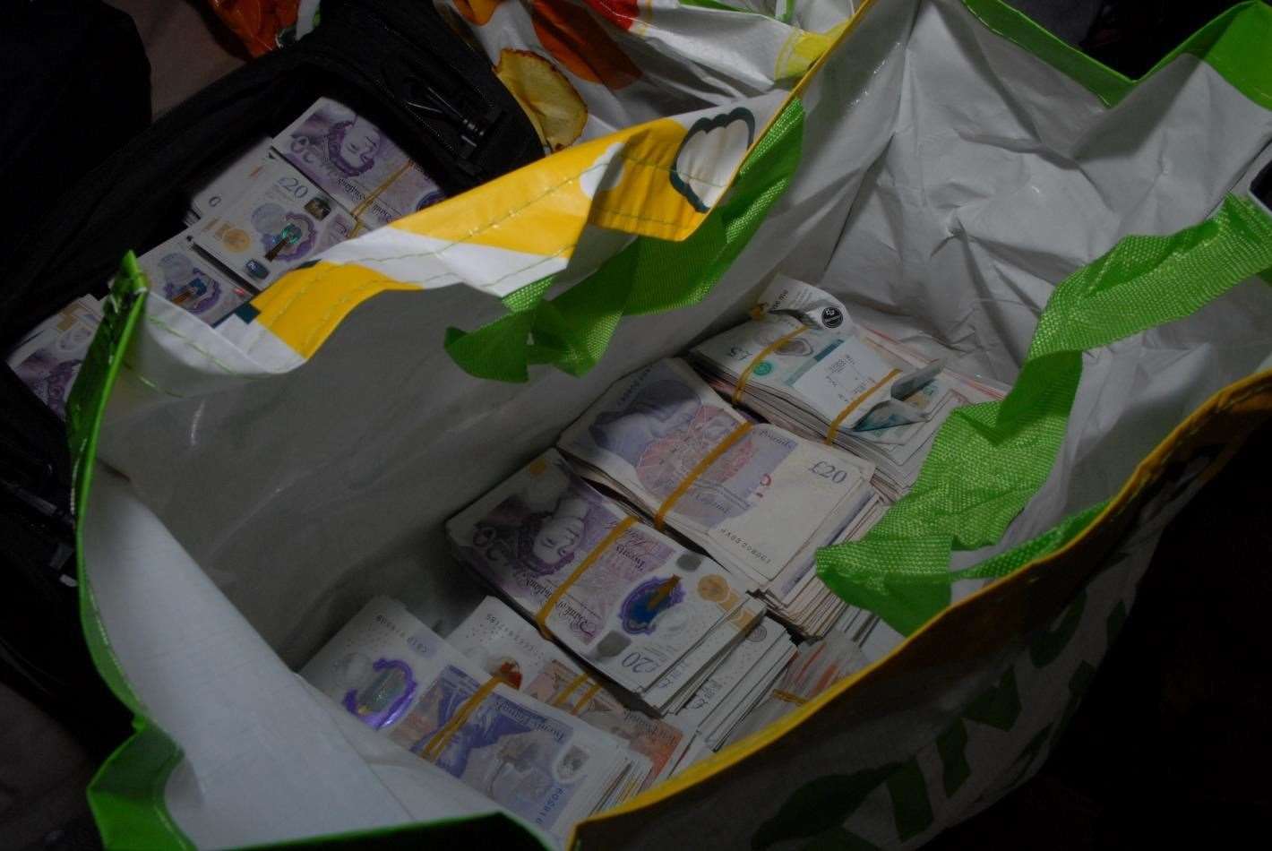 Cash uncovered in an Asda supermarket bag at his home in Sinclair Way, Dartford