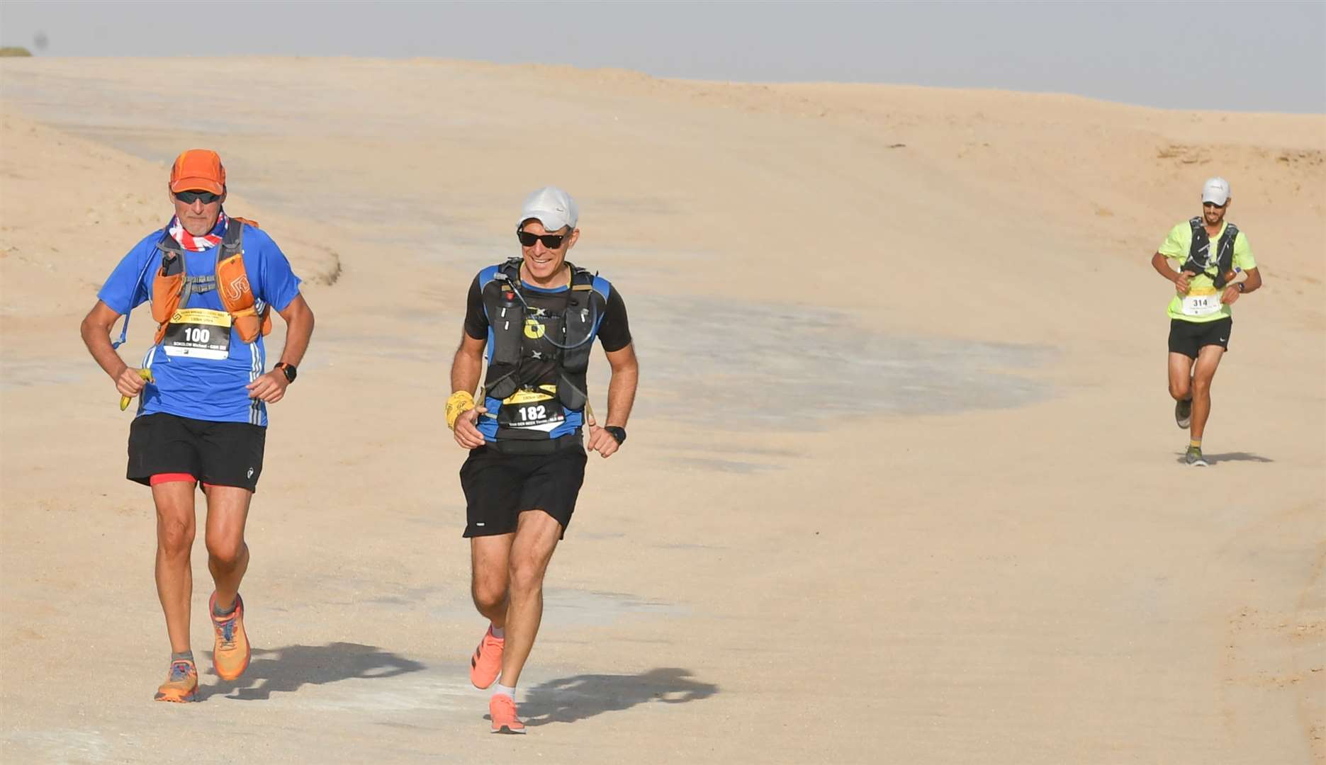 Michael Sokolow (left) takes on 100k in the Sahara heat. Picture: Jules Annan