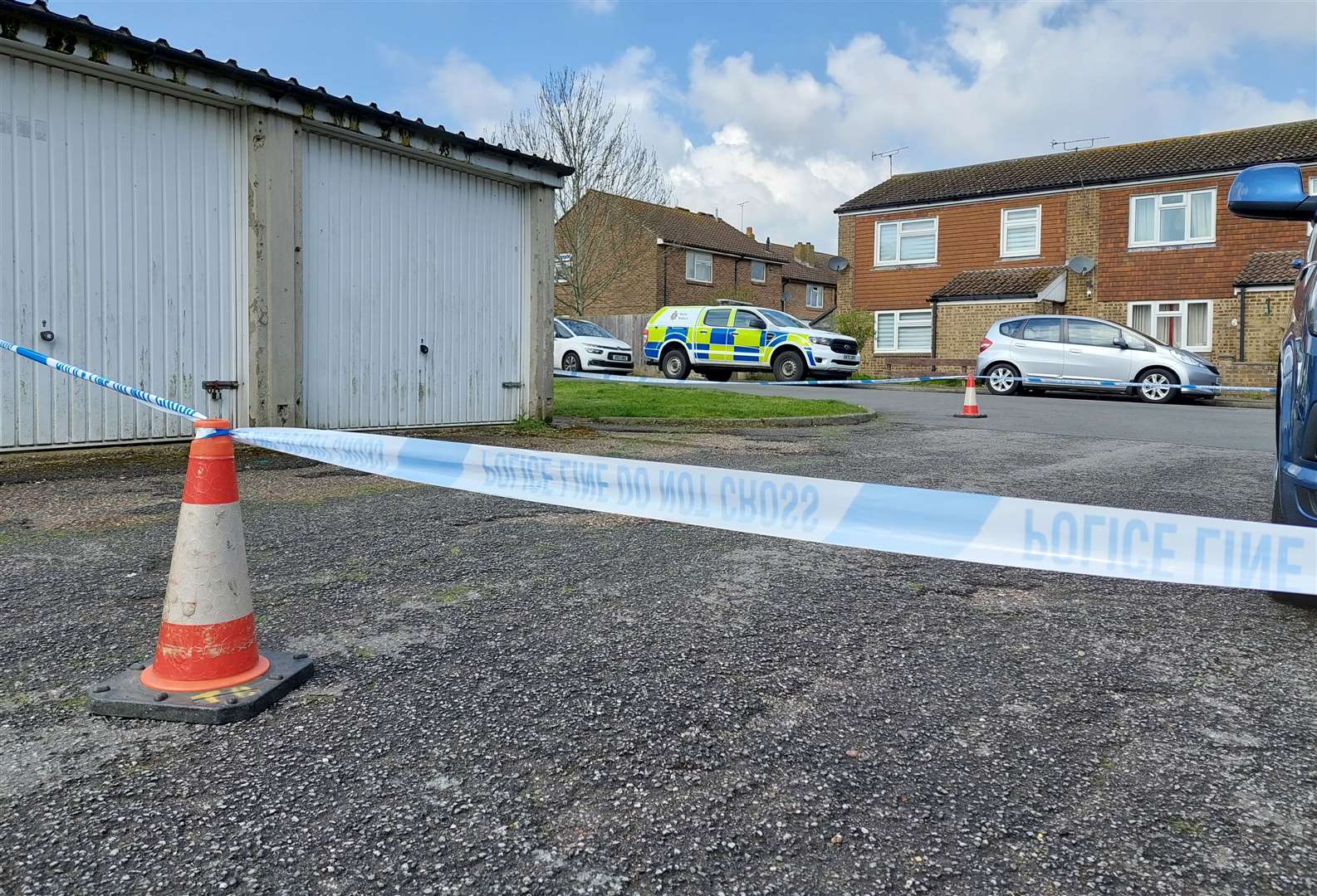 Police taped off a block of garages and part of an alleyway in Beecholme Drive