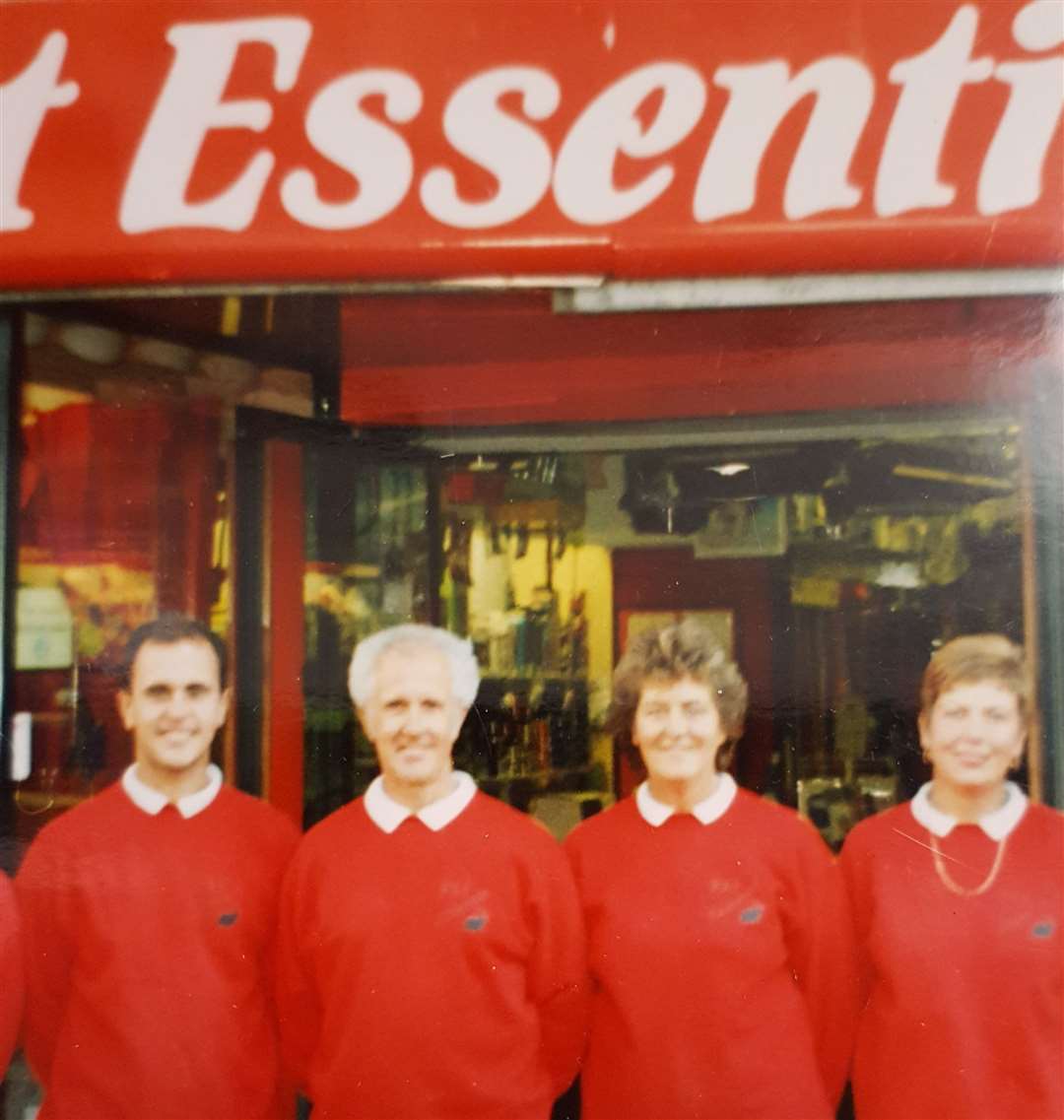 Gavin Wood pictured with his parents, Brian and Ann, as well as long-serving employee Mel Hills outside the store