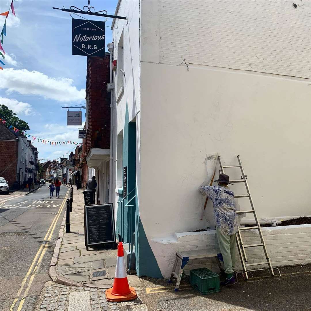 Lief Bruylant paints mural at The Notorious BRG in Castle Street, Canterbury. Picture: Jonny Wall