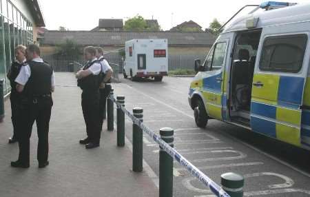 Police at the scene soon after the raiders struck. Picture: RICHARD EATON