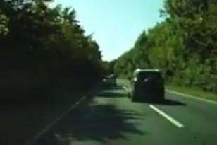 The jeep veers into the right lane as it approaches a bend on the A291.