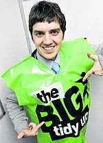 Medway Messenger reporter Keyan Milanian tries on a Big Tidy Up bib for size.