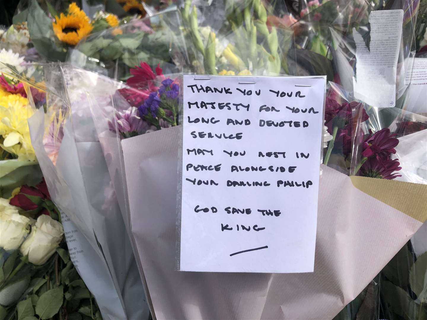 Written tributes have been left at the Queen Elizabeth II statue