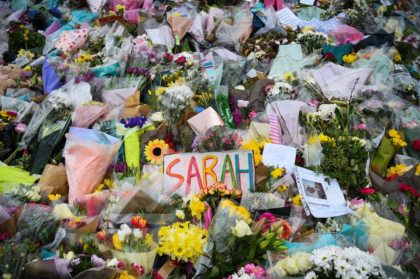 Floral tributes left next to the bandstand in Clapham Common, London, for Sarah Everard (Kirsty O’Connor/PA)