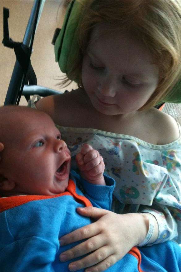 Annabelle gives her baby brother Ted a cuddle for the first time