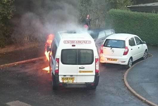 Flames from the taxi spread to two parked cars. Picture: Diane Hayman