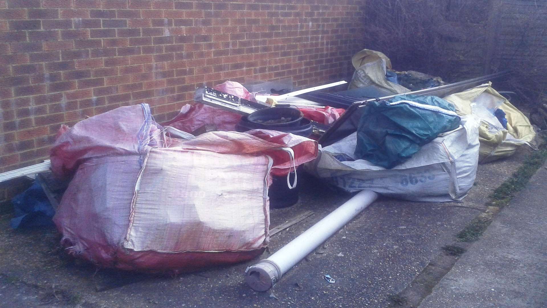 Maria Hooker and Dean West have been fined £2,500 for not clearing the junk dumped in the parking bay. Picture: Medway Council.